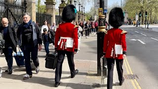 TWO GUARDS SEEN WALKING IN LONDON STREETS