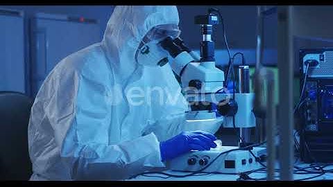 Scientist Examining Sample with a Microscope | Stock Footage - Envato elements