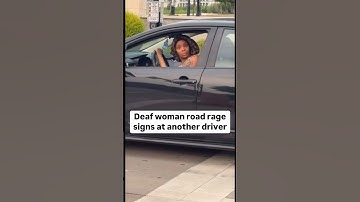 Deaf woman road rage signs at another driver 🫰