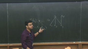 The v-Number of Monomial Ideals