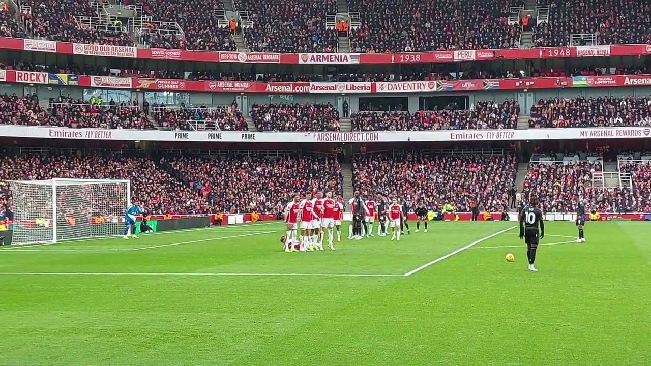 David Raya saves a free kick