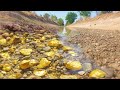 Found mining gold treasure under rock at river  young man mining gold explore