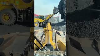 Balancing the Bulk: How a Loader Masterfully Slices a Hanging Sand Pile