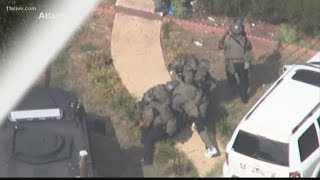Gunman wanted for terroristic threats in custody after SWAT takedown at home near I-75