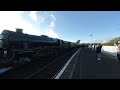 Steam engine 44871 pushing departs from Girvan in Scotland on 2019-05-02 at 1915 in VR180