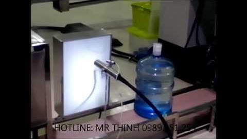 Máy in phun LINX   in date trên bình nước 21 lít