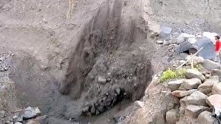 AN ATTEMPT TO DROP A LARGE BLACK ROCK ENDED IN A LARGE LANDSLIDE