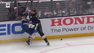 Drew Doughty upends Zach Hyman with a solid hit.