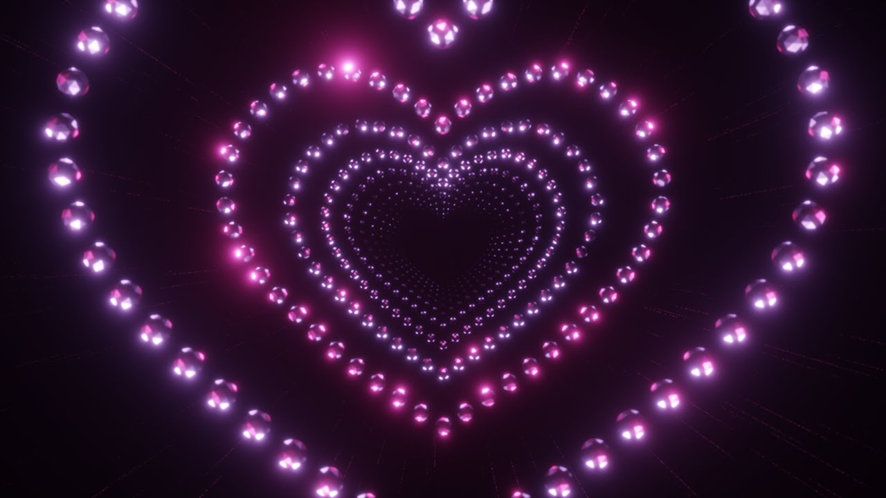 Tunnel of Pink Disco Balls Sparkling in The Shape of Hearts on a Black Background. 4K 60fps Loop