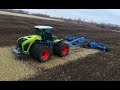 CLAAS XERION 5000 with 10m Lemken Rubin 9