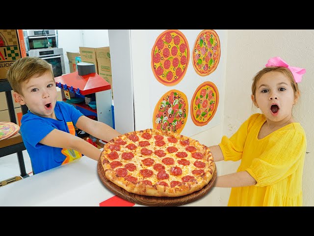 Kids learn how to cook pizza and help each other class=
