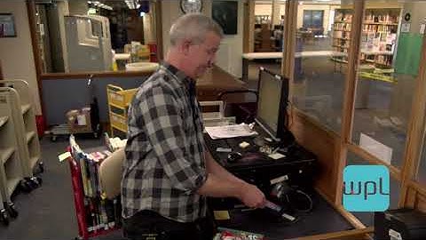 Mikes Library Tour - Checking Out a Book