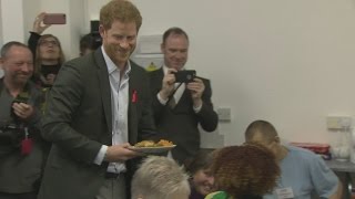 Harry follows in Diana's footsteps by visiting HIV charity