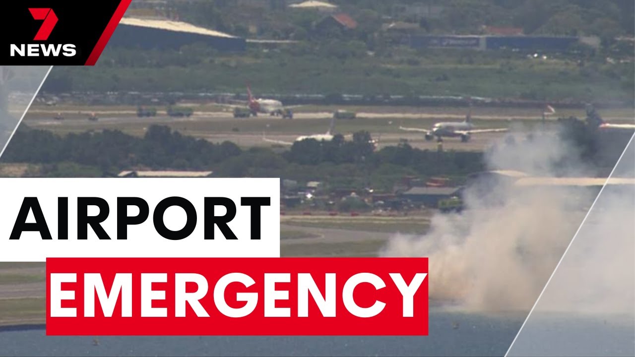 Grass fire ignites near Sydney Airport runway before Qantas flight makes emergency landing | 7NEWS