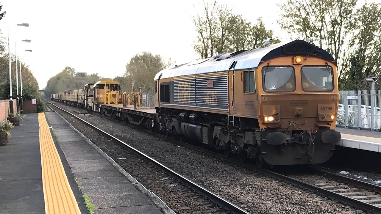 66785 GBRf John Ellis 6E30 with rail track carrying wagons  