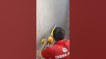 Construction workers fill the gaps between the wall panels.#shorts #construction #shortvideo