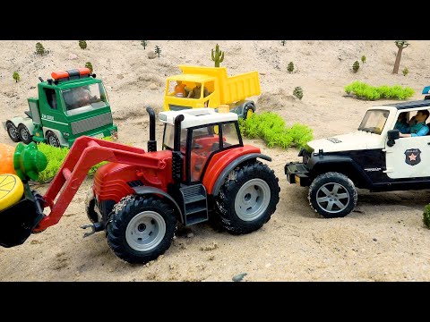 Un coche de policía y un camión buscan juntos un tractor en la arena