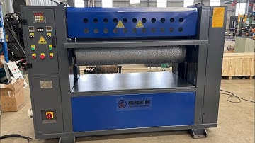 1300 double-sided embossing machine presses fire patterns on pine board.