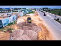 Shantui Bulldozer Pushing Sand With 5T Dump Trucks Filling Land