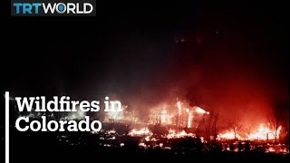 Wildfires burn hundreds of homes in Colorado, thousands flee