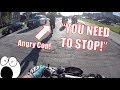 Angry Cop Nearly Pushes Biker Into Curb!