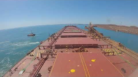 How a Ship Berthing at an Iron Ore Port for Loading...