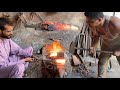 An Iron cutting chisel is being prepared at the furnace.