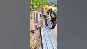 The process of installing the corrugated guardrail. Good tools make the job easy