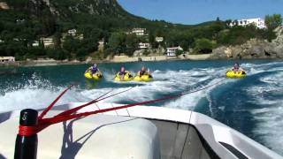 Paleo water sports, speed boat pulling hard 4 people on rings.