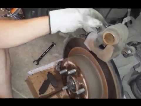 How to Replace rear brakes and rotors – Infiniti G35x 2008. Cute girl helps!