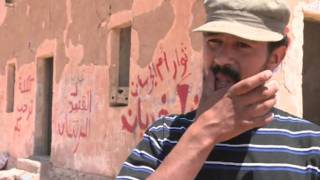 Libyan rebels battle to keep grip on mountain hamlet