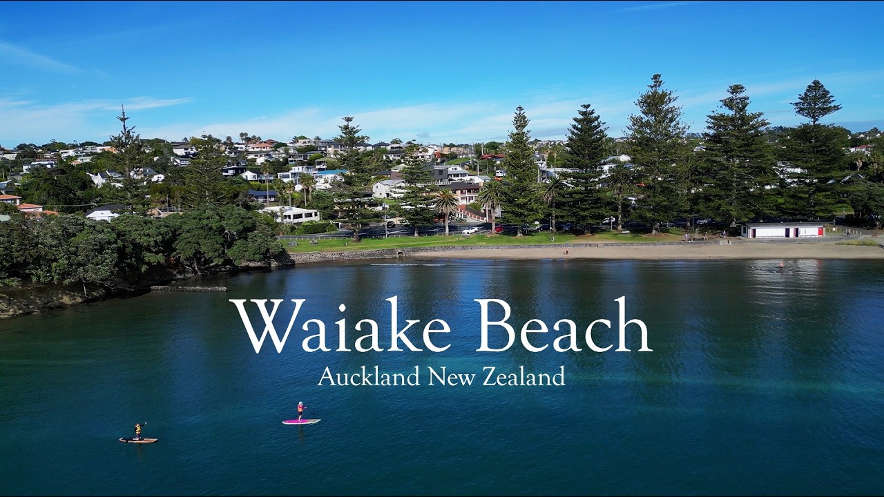 Waiake Beach - A beautiful small bay on Auckland's North Shore - New Zealand - Drone 4K