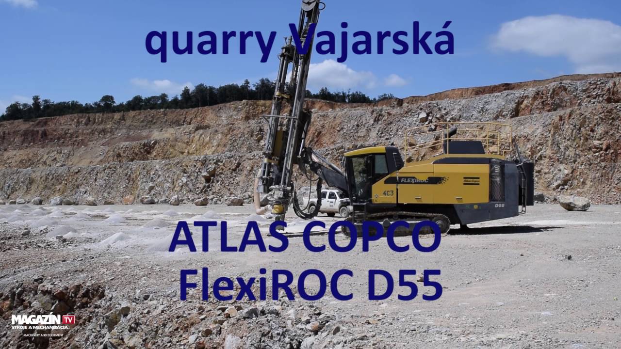 ATLAS COPCO FlexiROC D55 Down-the-hole rig drilling blast hole in quarry Vajarska