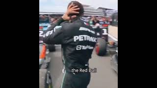 Lewis Hamilton inspecting the Red Bull and the Mclaren