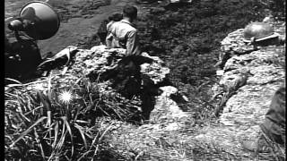 Okinawan civilians come in over mountain path to surrender, Okinawa. HD Stock Footage