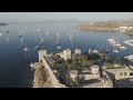 D-Log M. Bodrum, Turkey. Aerial drone view of Bodrum Castle guarding harbor entrance with yachts ...