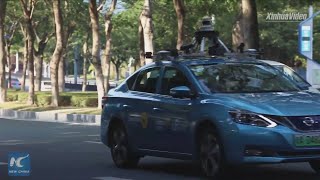 New China TV - Autonomous RoboTaxis Hit The Roads In Guangzhou [1080p]