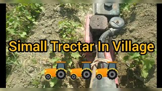 Simall Tarctar In Village Plow In Ground