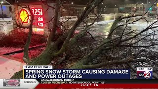 Trees and power lines down, slick pavement from spring storm