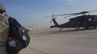 Mr. Fisher heading on a helicopter in Bagram Afghanistan