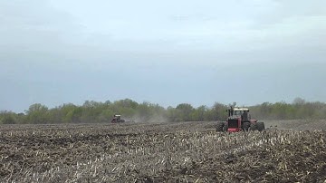 Versatile 535 and 375 Tractors pulling Case IH chisel plows in the same field.