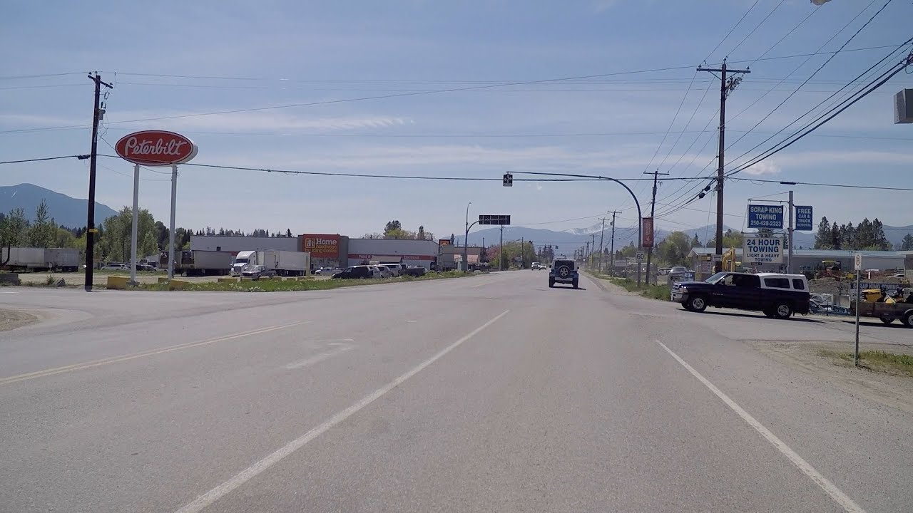 Driving to Creston Town in British Columbia Canada. Mountain to Farms