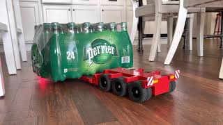 Double E  8x6 semi tractor transporting 24 bottles of water