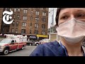 'People are dying and we can't look after them': ER doctor risks her job to film coronavirus victims inside an overstretched NYC hospital - as dozens of new patients line up outside