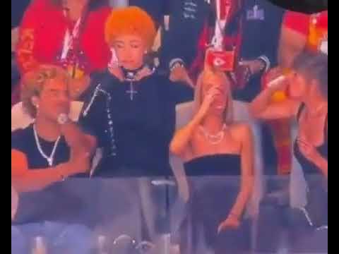 Taylor Swift's guest Ice Spice DEMONIC SIGN gestures while wearing