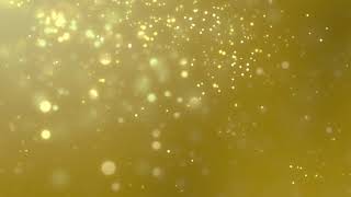 Blurred golden dust slowly falling against yellow | Video Effects