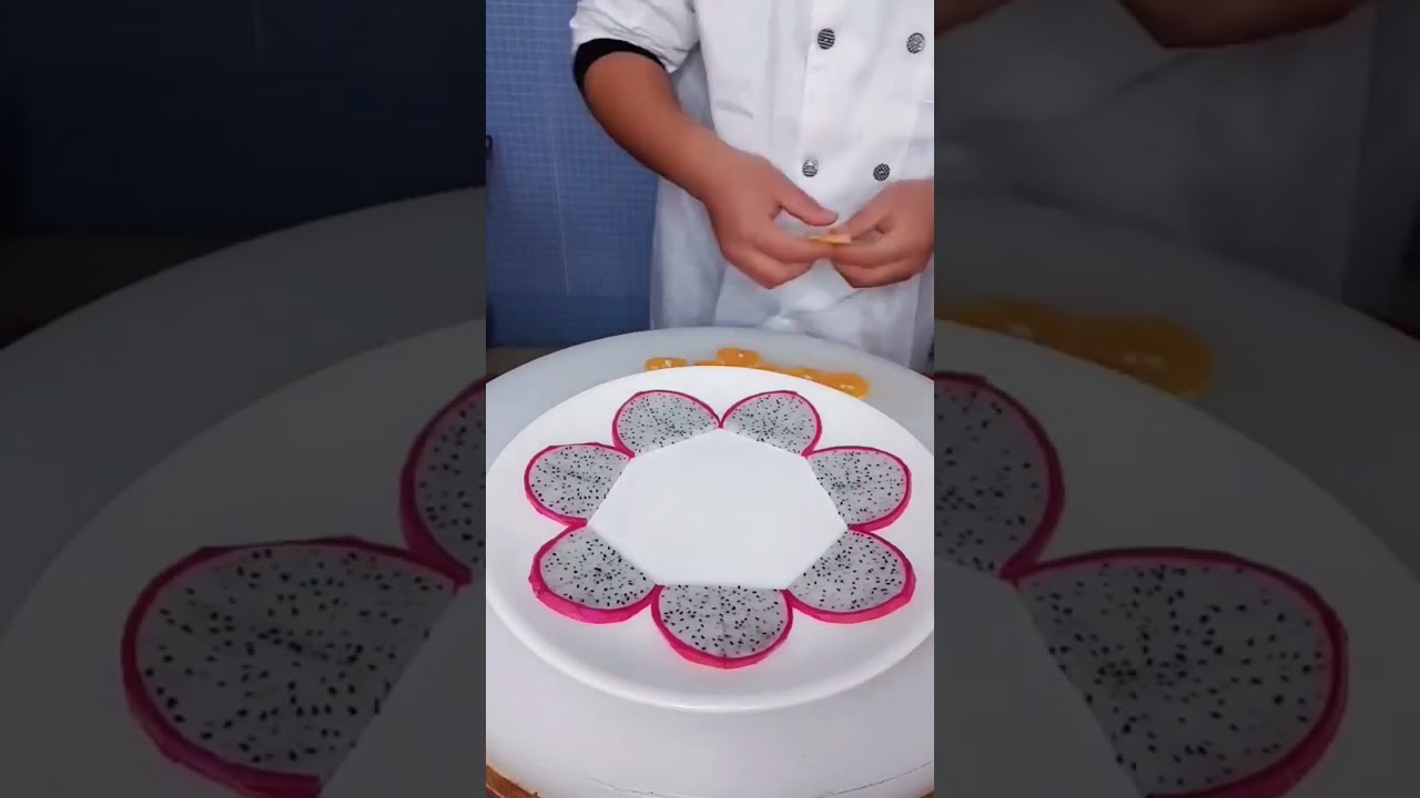 Fruits art design using dragon fruit orange and cocumber