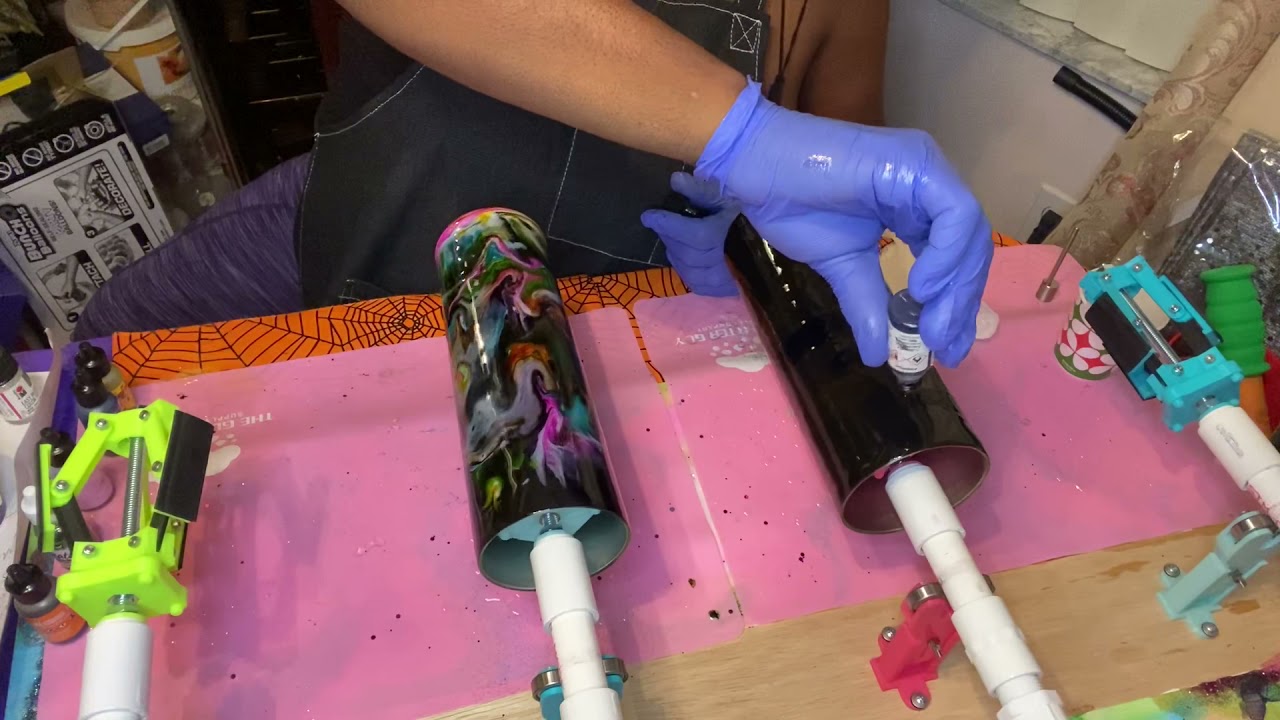 Alcohol ghost ink swirl tumbler surprise, on a black base.