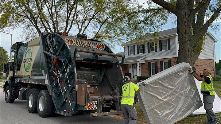 Big Fast Groot Mack MRU McNeilus Rear Loader Garbage Truck Packing Bulk Trash at Fall Clean Up