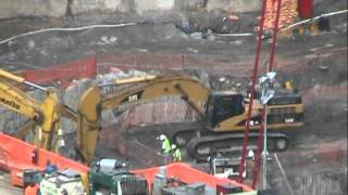 Cat 345C L digging dirt and rock
